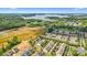 Aerial view highlighting homes in a community close to a lake at 17916 Ragtop Day Ln, Cornelius, NC 28031