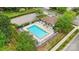 Aerial view of a community pool with ample seating and manicured landscaping at 17916 Ragtop Day Ln, Cornelius, NC 28031