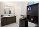 Bathroom features a double sink vanity, a mirror, and storage shelving at 1821 Sherrer Rd, York, SC 29745