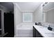 A clean bathroom with a bathtub, shower, and vanity with a mirror at 1821 Sherrer Rd, York, SC 29745