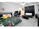 Spacious bedroom with carpet flooring, game-themed decor, and ample space for a desk and futon at 1821 Sherrer Rd, York, SC 29745