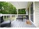 Relaxing covered front porch featuring outdoor furniture, perfect for enjoying the peaceful surroundings at 1821 Sherrer Rd, York, SC 29745