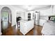 Bright and airy kitchen with white cabinetry, stainless steel appliances, and a granite-topped island at 1821 Sherrer Rd, York, SC 29745