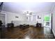 Open-concept living room with hardwood floors, neutral walls, and a view to the deck at 1821 Sherrer Rd, York, SC 29745