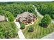 This house has mature landscaping and a circular driveway at 200 Waterby Way, Matthews, NC 28104