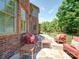 Back patio featuring ample seating, a stone pathway and partial fencing at 200 Waterby Way, Matthews, NC 28104