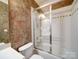 Bathroom featuring a shower and bathtub combination with decorative tile at 200 Waterby Way, Matthews, NC 28104