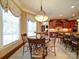 Charming breakfast nook with decorative lighting fixture and beautiful window views at 200 Waterby Way, Matthews, NC 28104