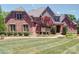 This home has mature landscaping at 200 Waterby Way, Matthews, NC 28104
