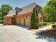 This beautiful home has a three car garage with an expansive driveway at 200 Waterby Way, Matthews, NC 28104