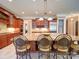 Gourmet kitchen boasts a large island with granite countertops and custom cabinetry at 200 Waterby Way, Matthews, NC 28104