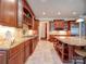 Spacious kitchen with custom cabinetry, a central island, and modern appliances for cooking convenience at 200 Waterby Way, Matthews, NC 28104