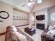 Cozy living room features a fireplace, built-in shelving, and comfortable seating at 200 Waterby Way, Matthews, NC 28104