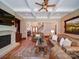 Spacious living room with fireplace, coffered ceilings, hardwood floors, and elegant furnishings at 200 Waterby Way, Matthews, NC 28104