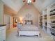 Spacious main bedroom with a high ceiling, built-in shelving, and soft carpeting at 200 Waterby Way, Matthews, NC 28104