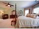 Large primary bedroom features a seating area, and a four-poster bed at 200 Waterby Way, Matthews, NC 28104