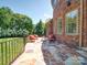 This home has a stone patio with an outdoor seating area at 200 Waterby Way, Matthews, NC 28104