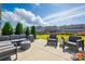 Spacious backyard with a patio and comfortable outdoor furniture at 2062 Nellies Way, Fort Mill, SC 29715