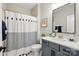 Well-lit bathroom with a shower-tub combo and a modern vanity at 2062 Nellies Way, Fort Mill, SC 29715