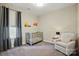 Bedroom featuring gray crib, cozy chair and truck decor for added visual appeal at 2062 Nellies Way, Fort Mill, SC 29715