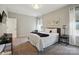 Well-lit bedroom featuring cozy furnishings and carpet floors at 2062 Nellies Way, Fort Mill, SC 29715