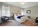 Comfortable bedroom with large windows, soft bedding, and stylish side tables at 2062 Nellies Way, Fort Mill, SC 29715