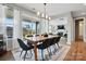 Bright dining room with large windows, decorative rug and a view into the Gathering room at 2062 Nellies Way, Fort Mill, SC 29715