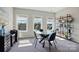Bright dining room with modern furnishings, and plenty of natural light from the windows at 2062 Nellies Way, Fort Mill, SC 29715