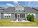 Rear exterior of home with screened in porch, patio and lawn at 2062 Nellies Way, Fort Mill, SC 29715