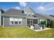 A spacious backyard with a screened porch and patio area at 2062 Nellies Way, Fort Mill, SC 29715