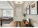 Welcoming foyer with wood floors, stylish lighting, and easy access to other living spaces at 2062 Nellies Way, Fort Mill, SC 29715