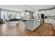 Spacious open kitchen with a center island, modern appliances, and hardwood flooring at 2062 Nellies Way, Fort Mill, SC 29715