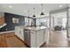 This open kitchen features a large island with stainless steel dishwasher and pendant lighting at 2062 Nellies Way, Fort Mill, SC 29715