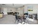 Cozy living area with a sectional sofa, dining table, and modern decor at 2062 Nellies Way, Fort Mill, SC 29715