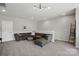 Bright living room with neutral tones, a comfortable sectional, and plush carpeting at 2062 Nellies Way, Fort Mill, SC 29715