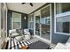Comfortable screened porch features a ceiling fan and backyard views at 2062 Nellies Way, Fort Mill, SC 29715