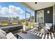 Cozy screened porch with stylish furniture and open views of the backyard at 2062 Nellies Way, Fort Mill, SC 29715