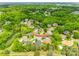 Aerial view of a residential neighborhood with mature trees, a pond, and well-maintained homes at 208 Mcduffie Ln, Fort Mill, SC 29715