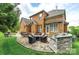 Outdoor space includes a stone patio with a dining table, seating, and a built-in grill at 208 Mcduffie Ln, Fort Mill, SC 29715