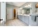 Bright bathroom features dual sinks, large mirror, and plenty of cabinet storage at 208 Mcduffie Ln, Fort Mill, SC 29715