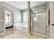 Bright bathroom with separate shower and tub, accessible from bedroom at 208 Mcduffie Ln, Fort Mill, SC 29715