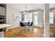 Charming breakfast nook features a modern chandelier, white table, and elegant blue chairs at 208 Mcduffie Ln, Fort Mill, SC 29715