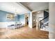 Elegant dining room with hardwood floors, blue walls, wainscoting, and chandelier at 208 Mcduffie Ln, Fort Mill, SC 29715