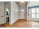Bright foyer with hardwood floors, wainscoting and high ceilings leading into the house at 208 Mcduffie Ln, Fort Mill, SC 29715