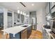 Bright kitchen with large center island, stainless steel appliances and hardwood flooring at 208 Mcduffie Ln, Fort Mill, SC 29715