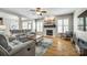 Bright living room with fireplace, neutral furniture, hardwood floors, and plenty of natural light at 208 Mcduffie Ln, Fort Mill, SC 29715