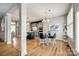 Open floor plan showing kitchen, breakfast nook, and architectural columns on hardwood floors at 208 Mcduffie Ln, Fort Mill, SC 29715