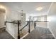 Loft space with overhead lighting, decorative railings, and neutral carpet at 208 Mcduffie Ln, Fort Mill, SC 29715
