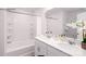 Modern bathroom with dual sinks, white cabinetry, and a tub/shower combination offers a clean and functional space at 227 Paige Rd, Kings Mountain, NC 28086