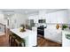 Modern kitchen with white cabinets, stainless steel appliances, and a large island with bar stools at 227 Paige Rd, Kings Mountain, NC 28086
